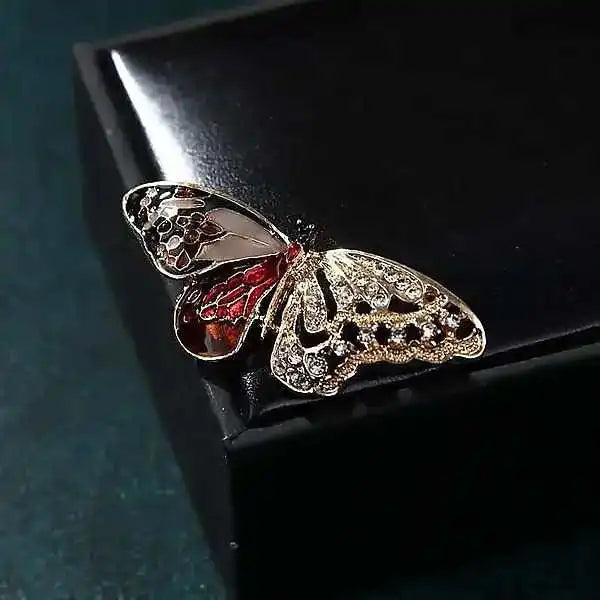 Butterfly Aura tarnish-resistant vintage silver butterfly brooch with red enamel left wing white zircon right wing and red center