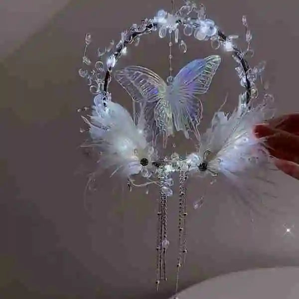 a diy feather butterfly wreath with a glowing centerpiece and soft accents for romantic home decor by Butterfly Aura