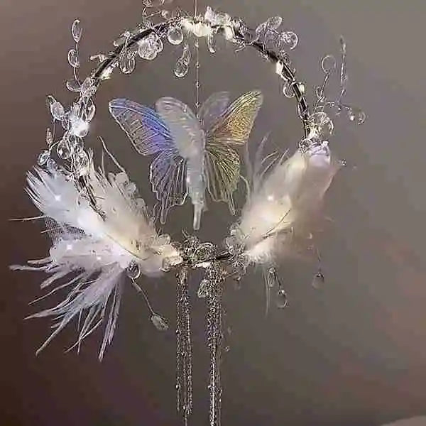 a diy feather butterfly wreath with a glowing centerpiece and soft accents for romantic home decor by Butterfly Aura