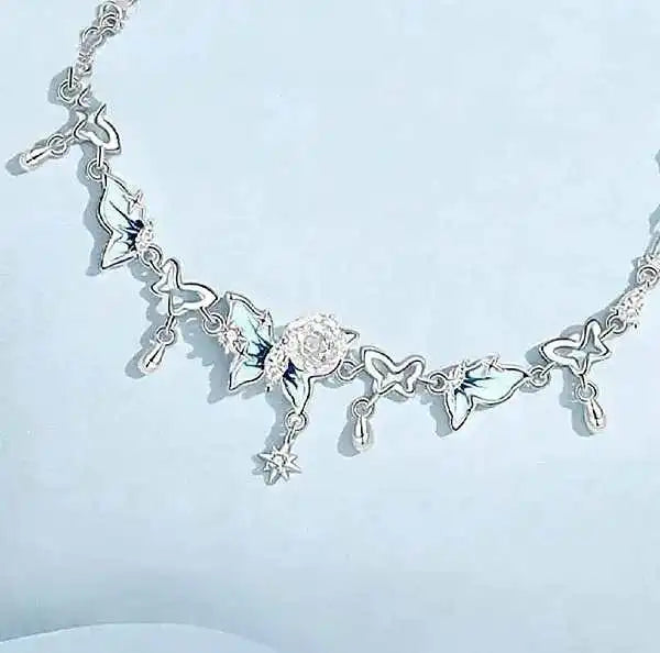 silver bracelet with a glowing enamel butterfly zircon accents and a tiny pearl charm for everyday wear by Butterfly Aura