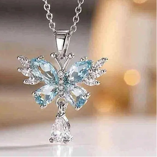 silver butterfly necklace set with lake blue and white CZ for everyday romance by Butterfly Aura