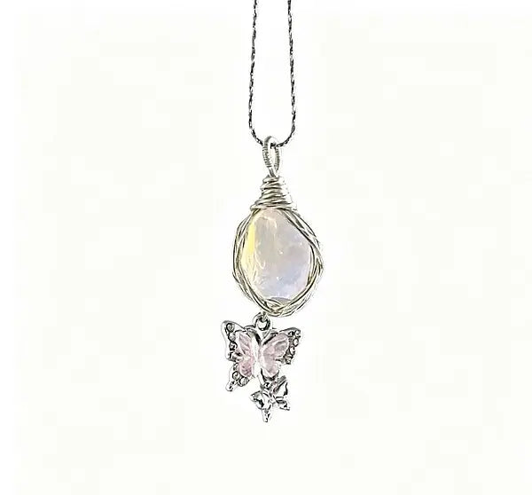silver necklace with a crystal pendant and a butterfly pendant set with your choice of colored crystals by Butterfly Aura