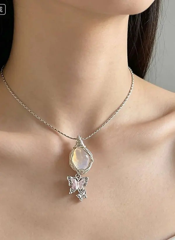 silver necklace with a crystal pendant and a butterfly pendant set with your choice of colored crystals by Butterfly Aura