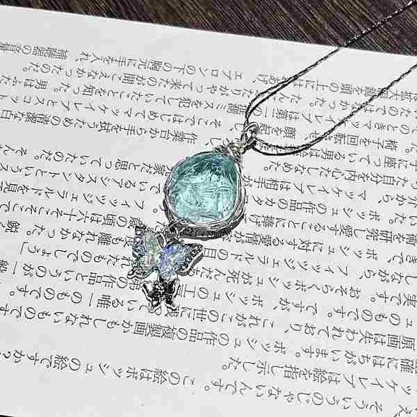 silver necklace with a crystal pendant and a butterfly pendant set with your choice of colored crystals by Butterfly Aura